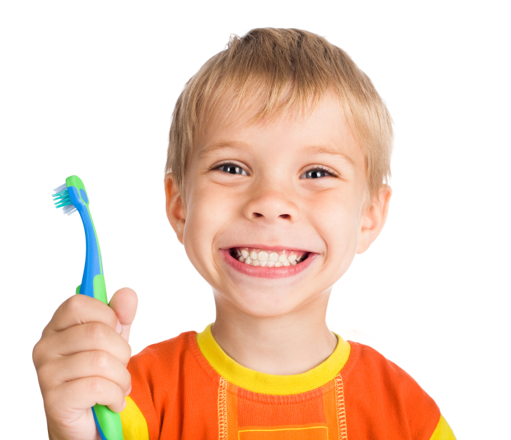 young boy smiling with toothbrush